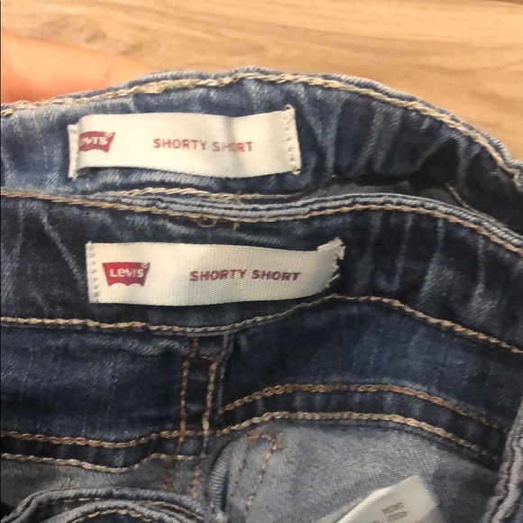 Two pairs of Levi’s shorty short denim shorts. - Picture 4 of 6